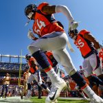Denver Broncos defensive players including linebacker Brandon Marshall #54 run onto the field to warm up before a game against the Seattle Seahawks at Broncos Stadium at Mile High on September 9, 2018 in Denver, Colorado. (Photo by Dustin Bradford/Getty Images)