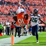 Wide receiver Emmanuel Sanders #10 of the Denver Broncos does a somersault into the end zone with a second quarter touchdown under coverage by cornerback Shaquill Griffin #26 of the Seattle Seahawks during a game at Broncos Stadium at Mile High on September 9, 2018 in Denver, Colorado. (Photo by Dustin Bradford/Getty Images)