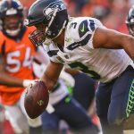 Quarterback Russell Wilson #3 of the Seattle Seahawks scrambles under pressure in the fourth quarter of a game against the Denver Broncos at Broncos Stadium at Mile High on September 9, 2018 in Denver, Colorado. (Photo by Dustin Bradford/Getty Images)