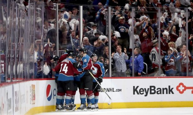 Members of the Colorado Avalanche celebrate their first goal against the Nashville Predators in Gam...