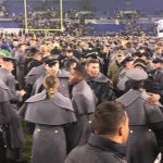 Cadets and fans rush the field as the Army Black Knights take down the Navy Midshipmen 21-17 to end the academy's 14-year losing streak. Photo by Armen Williams