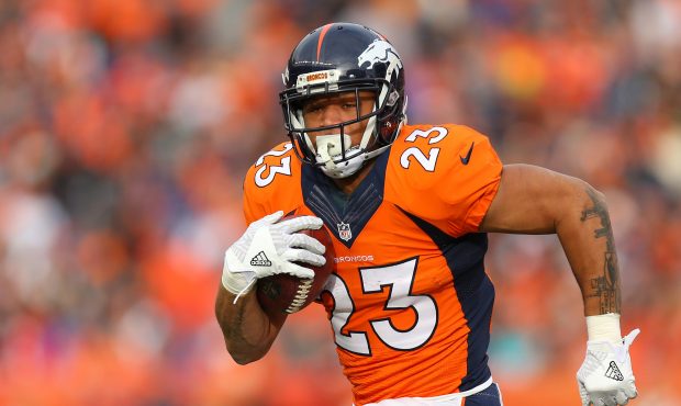 Running back Devontae Booker #23 of the Denver Broncos rushes for a touchdown in the first quarter ...