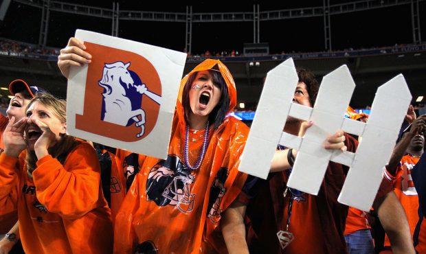 Fans support the Denver Broncos defense as they face the Oakland Raiders at Sports Authority Field ...