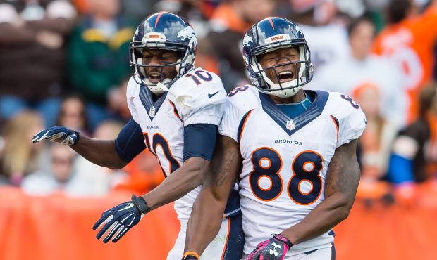 Wide receiver Emmanuel Sanders #10 celebrates with wide receiver Demaryius Thomas #88 of the Denver...