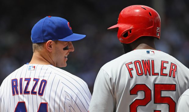 Anthony Rizzo #44 of the Chicago Cubs talks with former teammate Dexter Fowler #25 of the St. Louis...