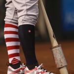 Mark Reynolds #12 of the Colorado Rockies, wearing American flag socks and shoes, stands on deck during the first inning of the MLB game against the Arizona Diamondbacks at Chase Field on July 2, 2017 in Phoenix, Arizona.  (Photo by Christian Petersen/Getty Images)