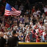Fans wave an American flag during the singing of 'God Bless America' in the seventh inning of the MLB game between the Arizona Diamondbacks and the Colorado Rockies at Chase Field on July 2, 2017 in Phoenix, Arizona.  The Diamondbacks defeated the Rockies 4-3. (Photo by Christian Petersen/Getty Images)