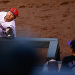 First baseman Mark Reynolds #12 of the Colorado Rockies reaches over the railing to the photo well to make a catch for the third out of the seventh inning against the Cincinnati Reds at Coors Field on July 4, 2017 in Denver, Colorado. The Reds defeated the Rockies 8-1. (Photo by Justin Edmonds/Getty Images)