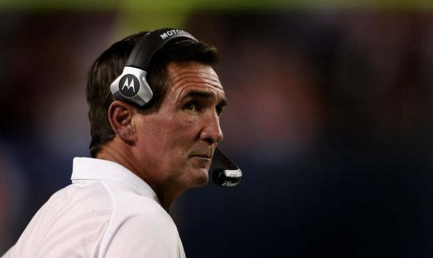 Head coach Mike Shanahan of the Denver Broncos oversees his team during NFL preseason action agains...