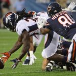 CHICAGO, IL - AUGUST 10:   Jamal Carter #20 of the Denver Broncos recovers a fumble as he's hit by  Cameron Meredith #81 of the Chicago Bears during a preseason game at Soldier Field on August 10, 2017 in Chicago, Illinois. (Photo by Jonathan Daniel/Getty Images)