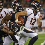 CHICAGO, IL - AUGUST 10:    Paxton Lynch #12 of the Denver Broncos breaks away from Jonathan Anderson #58 of the Chicago Bears during a preseason game at Soldier Field on August 10, 2017 in Chicago, Illinois. The Broncos defeated the Bears 24-17. (Photo by Jonathan Daniel/Getty Images)