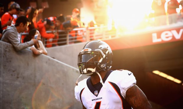 Stevan Ridley #4 of the Denver Broncos runs on to the field to warm up for their game against the S...