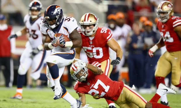 SANTA CLARA, CA - AUGUST 19: De'Angelo Henderson #33 of the Denver Broncos tries to run away from K...