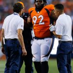 DENVER, CO - AUGUST 26:  nose tackle Zach Kerr #92 of the Denver Broncos is helped off the field by the training staff in the first quarter during a Preseason game against the Green Bay Packers at Sports Authority Field at Mile High on August 26, 2017 in Denver, Colorado. (Photo by Justin Edmonds/Getty Images)