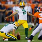 DENVER, CO - AUGUST 26:  Kicker Mason Crosby #2 of the Green Bay Packers kicks a first quarter field goal on a hold by Justin Vogel #5 as cornerback Lorenzo Doss #37 of the Denver Broncos looks on during a Preseason game at Sports Authority Field at Mile High on August 26, 2017 in Denver, Colorado. (Photo by Justin Edmonds/Getty Images)