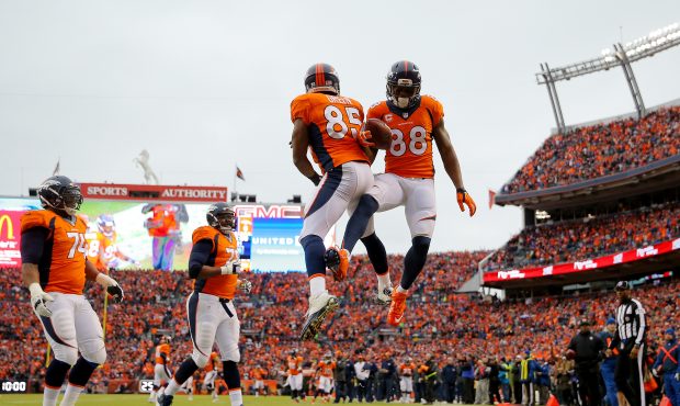 DENVER, CO - JANUARY 11:  Demaryius Thomas #88 celebrates a first quarter touchdown with Virgil Gre...