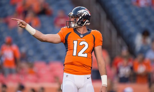Quarterback Paxton Lynch of the Denver Broncos points down the field during player warm ups before ...