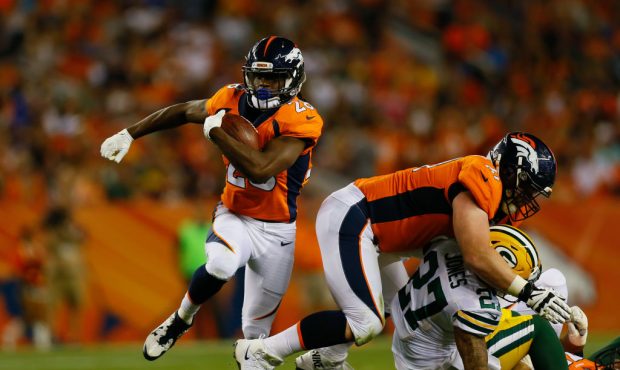 DENVER, CO - AUGUST 26:  Running back Jamaal Charles #28 of the Denver Broncos runs with the footba...