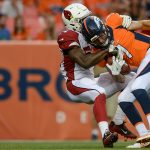 DENVER, CO - AUGUST 31: Linebacker Alex Bazzie #54 of the Arizona Cardinals sacks quarterback Kyle Sloter #1 of the Denver Broncos into the end zone for a first quarter safety during a preseason NFL game at Sports Authority Field at Mile High on August 31, 2017 in Denver, Colorado. (Photo by Dustin Bradford/Getty Images)