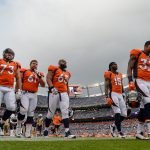 DENVER, CO - AUGUST 31: Denver Broncos players, including Allen Barbre #73, Nelson Adams #61, Ronald Leary #65, Marlon Brown #15, and Lorenzo Doss #37 walk off the field after warm ups before a preseason NFL game against the Arizona Cardinals at Sports Authority Field at Mile High on August 31, 2017 in Denver, Colorado. (Photo by Dustin Bradford/Getty Images)