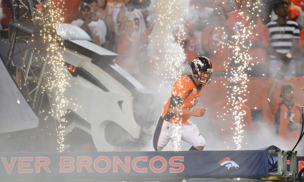 DENVER, CO - SEPTEMBER 11: Quarterback Trevor Siemian #13 of the Denver Broncos runs on to the fiel...