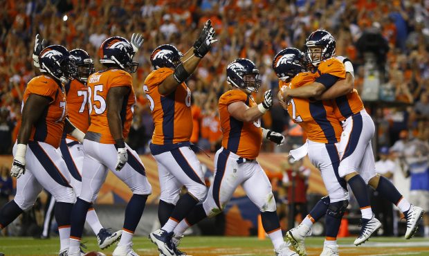 DENVER, CO - SEPTEMBER 11:  Quarterback Trevor Siemian #13 of the Denver Broncos celebrates rushing...