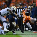 DENVER, CO - SEPTEMBER 11:  Running back C.J. Anderson #22 of the Denver Broncos is pushed out of bounds in the second quarter of the game against the Los Angeles Chargers at Sports Authority Field at Mile High on September 11, 2017 in Denver, Colorado. (Photo by Dustin Bradford/Getty Images)