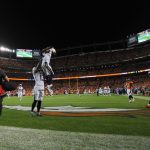 DENVER, CO - SEPTEMBER 11:  Wide receiver Travis Benjamin #12 of the Los Angeles Chargers celebrates scoring a touchdown with Keenan Allen #13 in the fourth quarter of the game against the Denver Broncos at Sports Authority Field at Mile High on September 11, 2017 in Denver, Colorado. (Photo by Dustin Bradford/Getty Images)