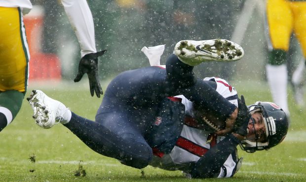 GREEN BAY, WI - DECEMBER 04:  Brock Osweiler #17 of the Houston Texans dives to the ground in the f...
