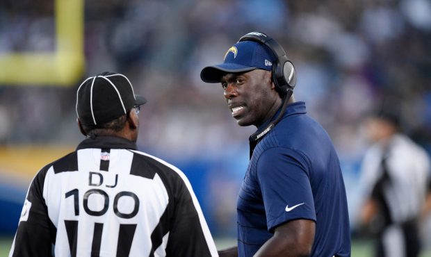 CARSON, CA - AUGUST 20: Coach Anthony Lynn (L) of the Los Angeles Chargers complains to head linesm...