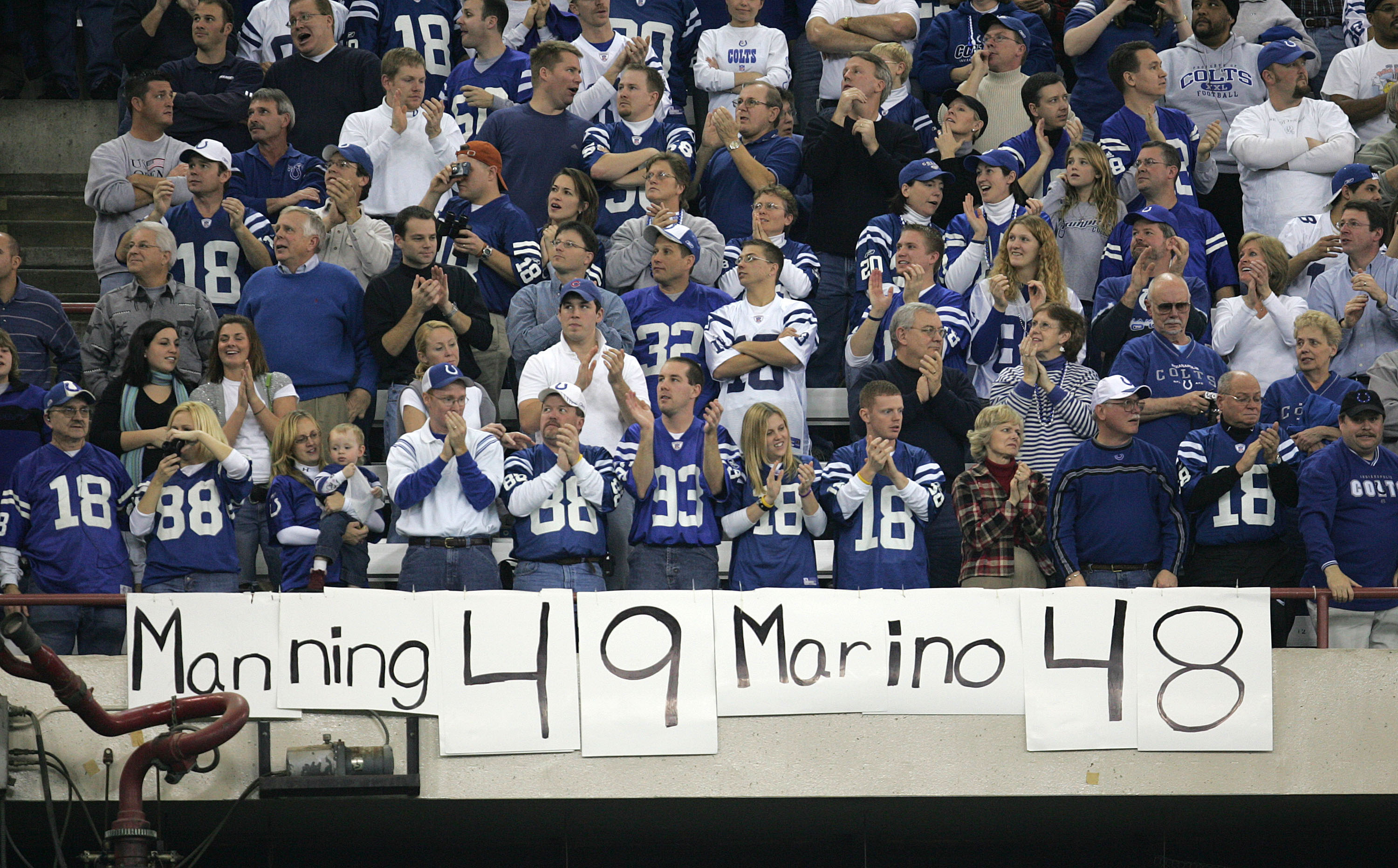 Peyton Manning fan holds up a sign while wearing a Manning Indianapolis Colts  Jersey before the Denver Broncos take on the Chicago Bears in Chicago -  Chicago Photographer & Director of Photography