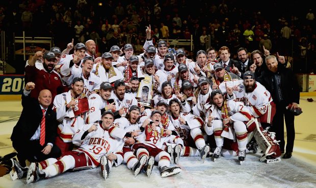 CHICAGO, IL - APRIL 08: The Denver Pioneers celebrate after beating the Minnesota-Duluth Bulldogs d...
