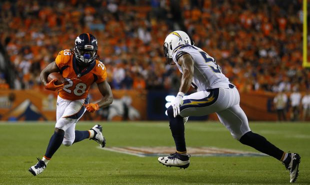DENVER, CO - SEPTEMBER 11:  Running back Jamaal Charles #28 of the Denver Broncos rushes for a gain...