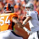 DENVER, CO - OCTOBER 1:  Quarterback Derek Carr #4 of the Oakland Raiders looks to pass under pressure by inside linebacker Brandon Marshall #54 of the Denver Broncos in the first half of a game at Sports Authority Field at Mile High on October 1, 2017 in Denver, Colorado. (Photo by Matthew Stockman/Getty Images)