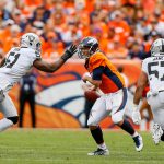 DENVER, CO - OCTOBER 1:  Quarterback Trevor Siemian #13 of the Denver Broncos tries to avoid a hit by outside linebacker Bruce Irvin #51 of the Oakland Raiders during a game at Sports Authority Field at Mile High on October 1, 2017 in Denver, Colorado. (Photo by Justin Edmonds/Getty Images)