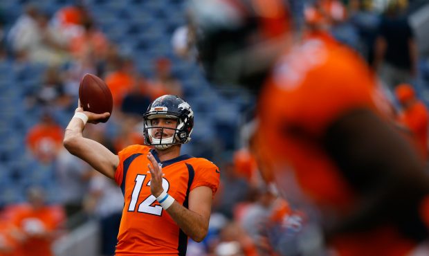 DENVER, CO - AUGUST 26: Quarterback Paxton Lynch #12 of the Denver Broncos warms up before a Presea...