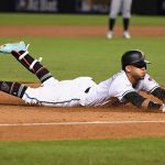 PHOENIX, AZ - OCTOBER 04: Ketel Marte #4 of the Arizona Diamondbacks slides into third base during the bottom of the second inning of the National League Wild Card game against the Colorado Rockies at Chase Field on October 4, 2017 in Phoenix, Arizona.  (Photo by Norm Hall/Getty Images)