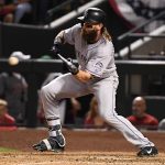 PHOENIX, AZ - OCTOBER 04: Charlie Blackmon #19 of the Colorado Rockies bunts during the top of the seventh inning of the National League Wild Card game against the Arizona Diamondbacks at Chase Field on October 4, 2017 in Phoenix, Arizona.  (Photo by Norm Hall/Getty Images)