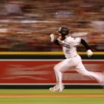 PHOENIX, AZ - OCTOBER 04:  Archie Bradley #25 of the Arizona Diamondbacks runs after hitting aN RBI triple during the bottom of the seventh inning of the National League Wild Card game against the Colorado Rockies at Chase Field on October 4, 2017 in Phoenix, Arizona.  (Photo by Christian Petersen/Getty Images)