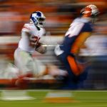 DENVER, CO - OCTOBER 15:  Running back Orleans Darkwa #26 of the New York Giants runs with the football for a long gain as strong safety Justin Simmons #31 of the Denver Broncos defends during the second quarter at Sports Authority Field at Mile High on October 15, 2017 in Denver, Colorado. (Photo by Justin Edmonds/Getty Images)