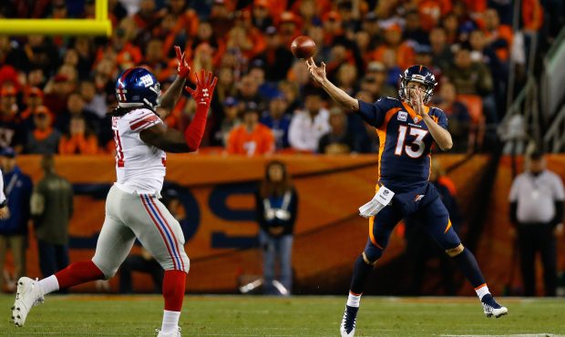 DENVER, CO - OCTOBER 15: Quarterback Trevor Siemian #13 of the Denver Broncos shows a pass on the r...
