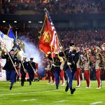 KANSAS CITY, MO - OCTOBER 30: Members of the armed forces present the colors running on to the field prior to the game between the Denver Broncos and Kansas City Chiefs at Arrowhead Stadium on October 30, 2017 in Kansas City, Missouri. ( Photo by Jason Hanna/Getty Images )