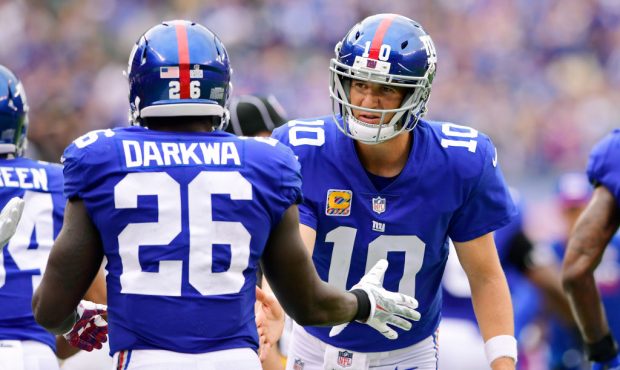 EAST RUTHERFORD, NJ - OCTOBER 08: Eli Manning #10 congratulates Orleans Darkwa #26 of the New York ...