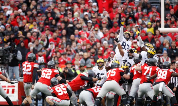 Tyler Durbin #92 of the Ohio State Buckeyes kicks a field goal to force overtime against the Michig...
