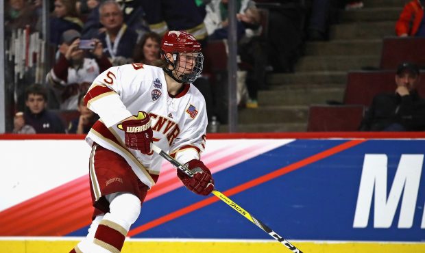 Henrik Borgstrom #5 of the Denver Pioneers advances the puck against the Notre Dame Fighting Irish ...