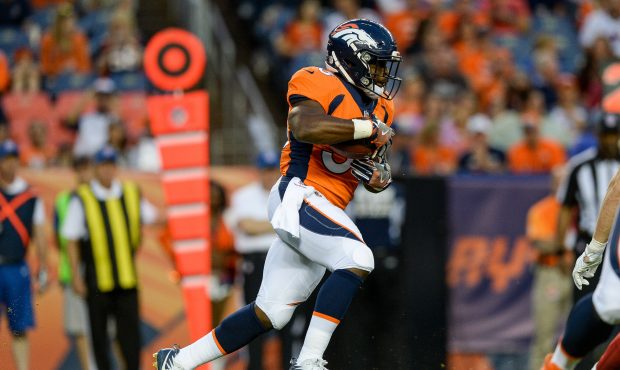 DENVER, CO - AUGUST 31: Running back De'Angelo Henderson #33 of the Denver Broncos rushes against t...
