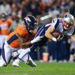 DENVER, CO - NOVEMBER 12:  Running back Rex Burkhead #34 of the New England Patriots is tackled by inside linebacker Brandon Marshall #54 of the Denver Broncos after a catch in the first quarter of a game at Sports Authority Field at Mile High on November 12, 2017 in Denver, Colorado. (Photo by Dustin Bradford/Getty Images)