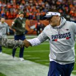 DENVER, CO - NOVEMBER 12:  Offensive coordinator Josh McDaniels shakes hands with a member of the armed forces on the field before a game between the Denver Broncos and the New England Patriots at Sports Authority Field at Mile High on November 12, 2017 in Denver, Colorado. (Photo by Dustin Bradford/Getty Images)