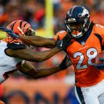 DENVER, CO - NOVEMBER 19:  Running back Jamaal Charles #28 of the Denver Broncos gives a stiff arm to cornerback Dre Kirkpatrick #27 of the Cincinnati Bengals in the third quarter of a game at Sports Authority Field at Mile High on November 19, 2017 in Denver, Colorado. (Photo by Dustin Bradford/Getty Images)