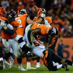 DENVER, CO - NOVEMBER 19:  Running back C.J. Anderson #22 of the Denver Broncos fumbles the ball as he is hit by outside linebacker Vontaze Burfict #55 of the Cincinnati Bengals in the fourth quarter of a game at Sports Authority Field at Mile High on November 19, 2017 in Denver, Colorado. (Photo by Dustin Bradford/Getty Images)